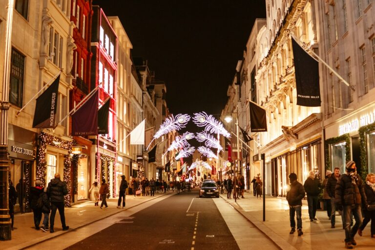 a street with people walking on it and buildings on the side